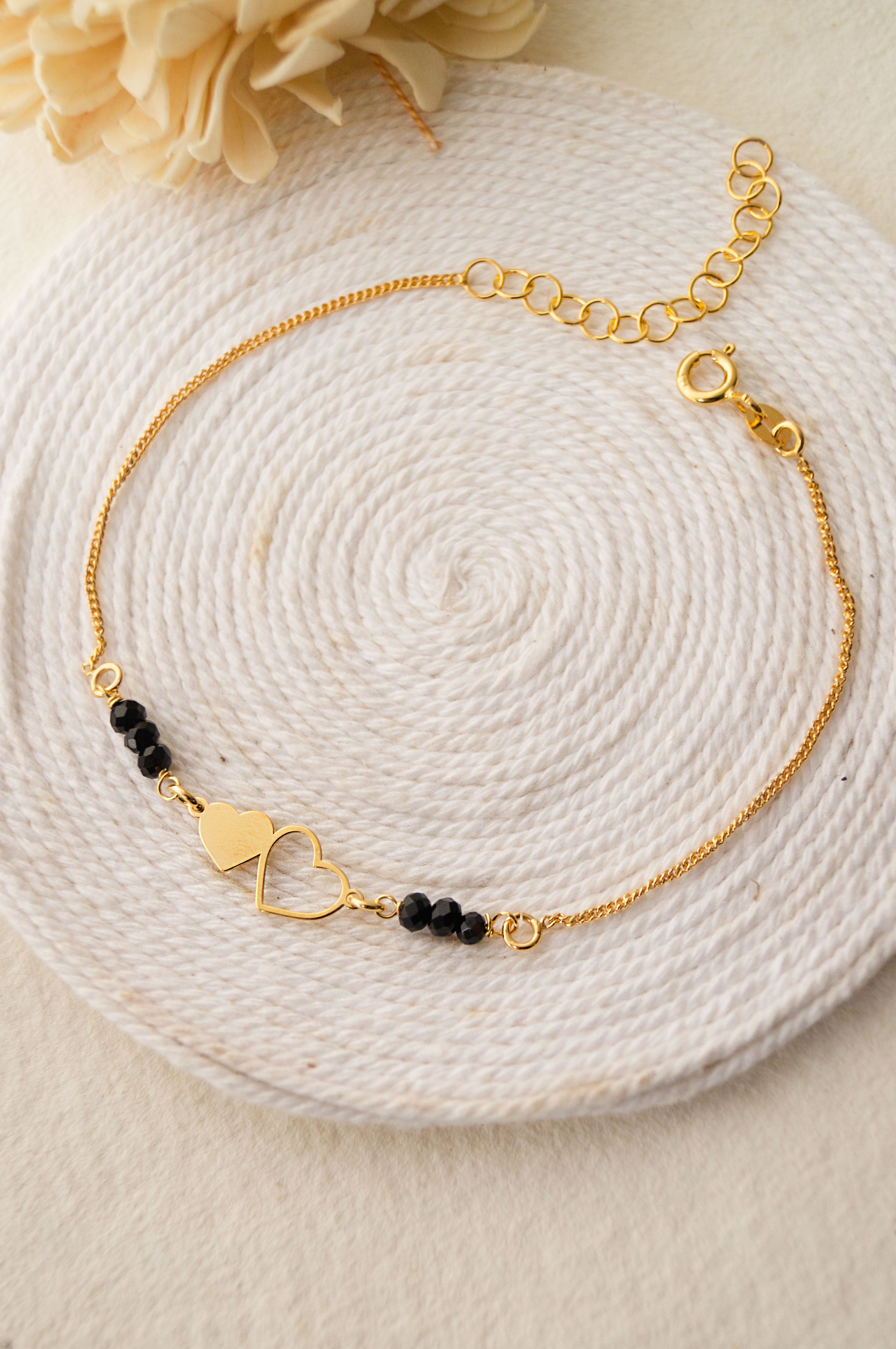 Black bead bracelet with gold on sale