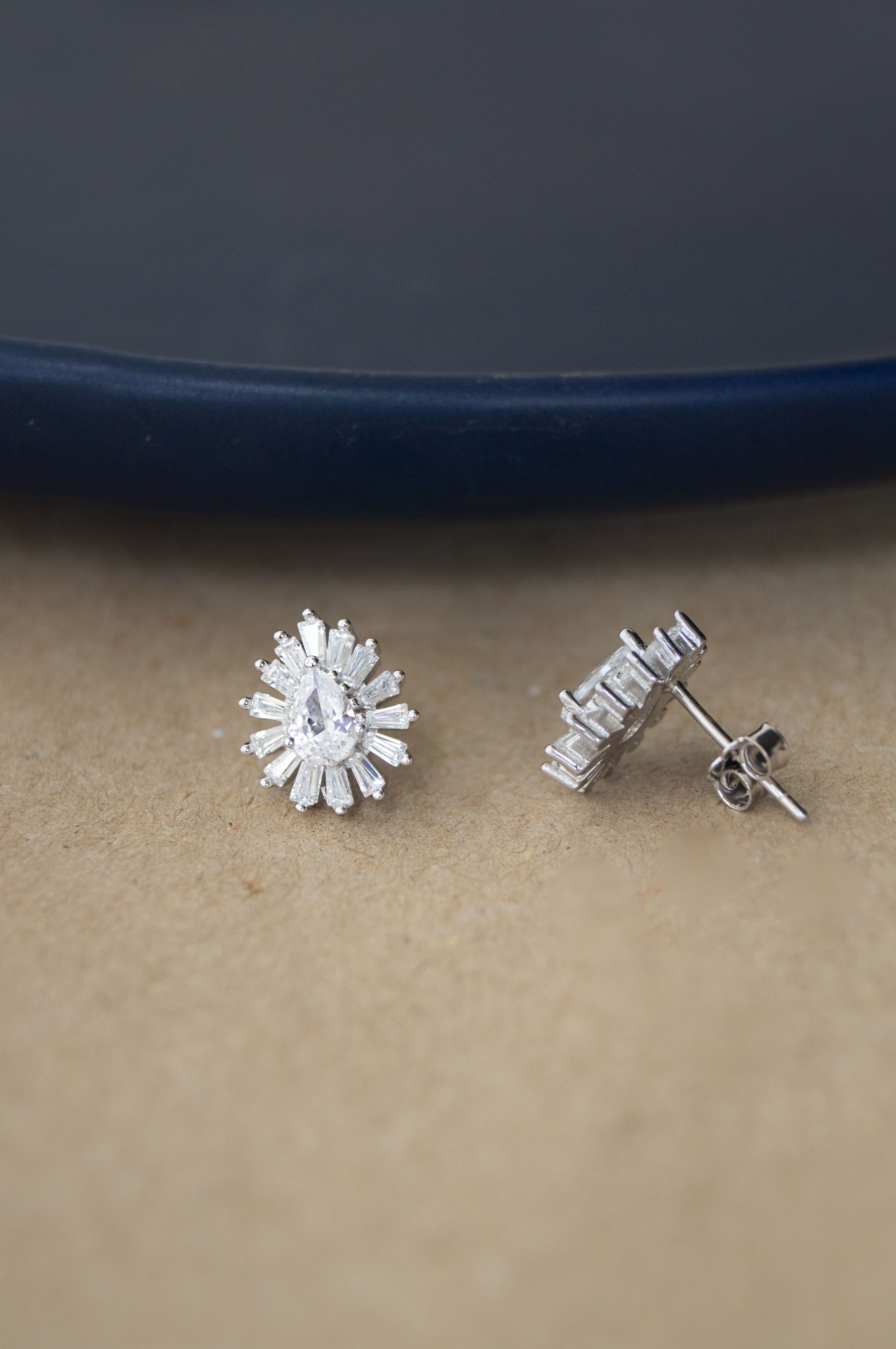 Sterling Silver Stud Earrings Set With 1 Diamond Each And Adorned With An  Interlocking Heart Filigree